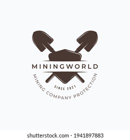 Vintage mining shovel and shield logo design. Vector illustration of mining shovel and shield for company protection logo design.
