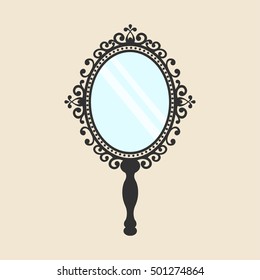 vintage mirror with a handle on the background