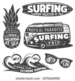 Vintage monochrome surfing graphics set with inscriptions and letterings on pineapple bus water waves sunglasses isolated vector illustration