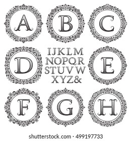 Vintage monogram kit. Black patterned letters and floral round frames for creating initial logo in victorian style.