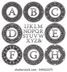 Vintage monogram kit. Black patterned letters and floral round frames for creating initial logo in victorian style.