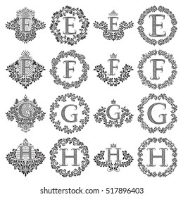 Vintage monograms set of letters E, F, G, H. Heraldic coats of arms, symbols in floral round frames.