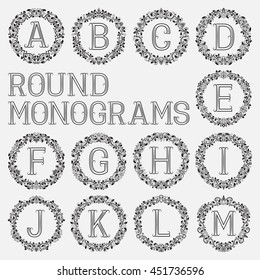 Vintage monograms set. Letters from A to M in round floral frames.
