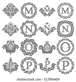 Vintage monograms set of letters M, N, O, P. Heraldic coats of arms, symbols in floral round frames.