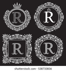 Vintage monograms set of R letter. Heraldic coats of arms in wreaths, round and square frames. White symbols on black.