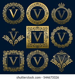 Vintage monograms set of V letter. Golden heraldic logos in wreaths, round and square frames.