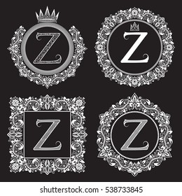 Vintage monograms set of Z letter. Heraldic coats of arms in wreaths, round and square frames. White symbols on black.