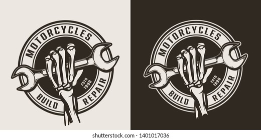 Vintage motorcycle repair service round logo with skeleton hand holding wrench isolated vector illustration