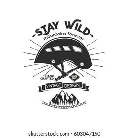 Vintage mountaineering badge. Climbing logo, vintage vector emblem. Climb gear - helmet and text "Stay wild - mountains forever". Retro t shirt design. Old style illustration.