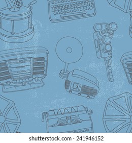 Vintage musical and photo equipment seamless vector pattern on grungy blue background.