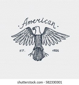 vintage old logo or badge, label engraved and old hand drawn style with wild bald eagle.
