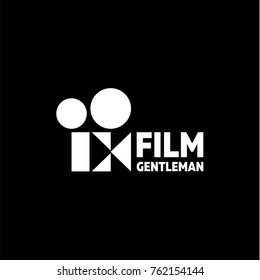 Vintage old Movie Camera with an abstract sign with a built-in butterfly as a gentleman movie, a breezy logo with a double meaning