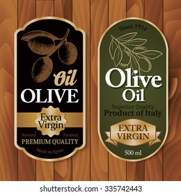 Vintage olive oil labels on wooden background vector illustration