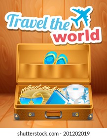 Vintage open suitcase with clothes for vacation
