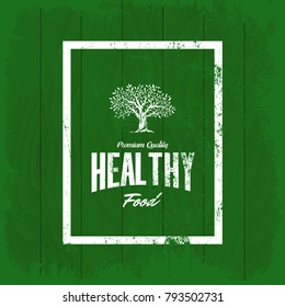 Vintage organic, natural and healthy food vector logo isolated on wood board background. Premium quality green and fresh products grunge logotype emblem illustration. Superior signboard retro design.