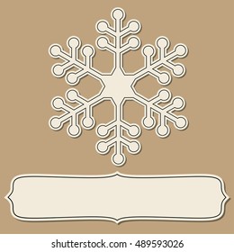 Vintage paper empty frame with snowflakes over brown backgrounds.