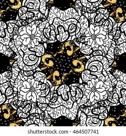 Vintage pattern on black background with golden elements.