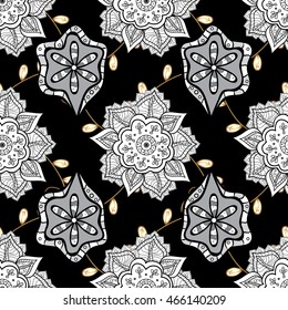 Vintage pattern on black background with golden elements.