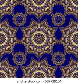 Vintage pattern on blue background. Seamless pattern with golden elements for design in retro style. Universal vector pattern for wallpapers, textile, fabric, wrapping paper, packaging box etc.