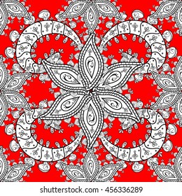 Vintage pattern on red background with white floral elements.