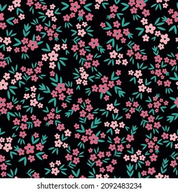 Vintage pattern. small pink flowers and green leaves . black background. Seamless vector template for design and fashion prints.