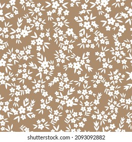 Patrón vintage. Pequeñas flores y hojas blancas. Fondo beige. Plantilla vectorial perfecta para impresiones de diseño y moda.