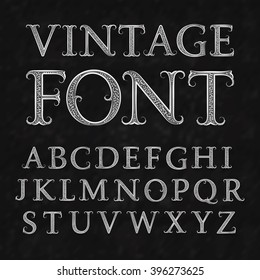 Vintage patterned letters. Vintage font in floral baroque style. Vintage latin alphabet. Vintage white capital letters on a black textured background.