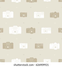 Vintage photo camera pattern. Shape white and brown on beige background. Vector seamless background. Ready for printing on textile and other seamless design. 