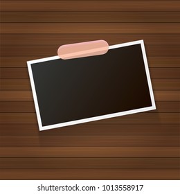 vintage photo frame with shadow isolated on wooden wall background. Vector Photo realistic Mockups with empty space for photo. old photo icon
