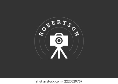Vintage photo video camera with lens on tripod professional photography service logo design template vector illustration. Photographer retro equipment travel blog shot emblem company mark