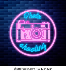 Vintage photographer emblem glowing neon sign