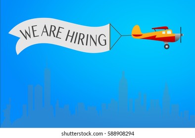 Vintage Plane with "We are hiring" banner above the city. Vetor Illustration. Blue background. For your web design.