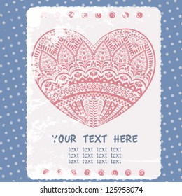 Vintage postcard with ornamental heart on  blue dotted backdrop