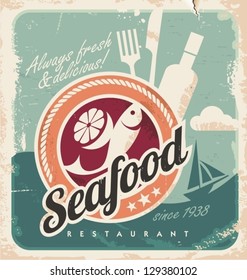 Vintage poster for seafood restaurant. Retro paper background with fish, wine bottle and food. Old fashioned graphic design.