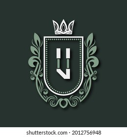 Vintage premium monogram of letter U. Heraldic coat of arms in form of shield surrounded by floral ornament and crown.