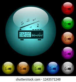 Vintage radio clock with music icons in color illuminated spherical glass buttons on black background. Can be used to black or dark templates