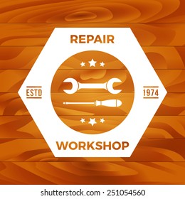 vintage repair workshop label on wooden background. eps10