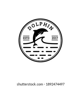 Vintage retro Dolphin jump under water ocean for holiday vacation outdoor logo design