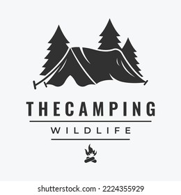 Vintage and retro outdoor camping or camping tent logo.With tent sign, trees and campfire.Camping for adventurers, scouts, climbers.