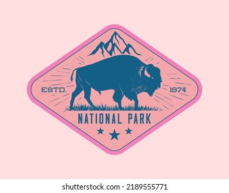 Vintage retro wildlife badge or label design template with bison or buffalo bull and mountain peak on background. Vector illustration