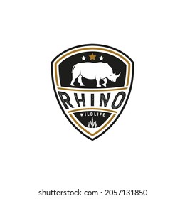 Vintage Rhino Logo. With rhinoceros, shield, and cactus icon. Premium, luxury, black, and gold logo design