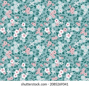 Vintage seamless floral pattern. Ditsy style background of small pastel color flowers. Small blooming flowers scattered over a blue background. Stock vector for printing on surfaces and web design.