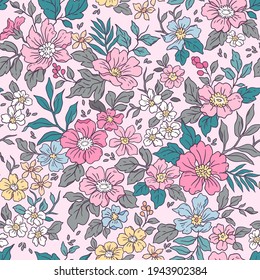 Vintage seamless floral pattern. Liberty style background of small coral pink flowers. Small flowers scattered over a pale pink background. Stock vector for printing on surfaces. Realistic flowers. 