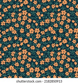 Vintage seamless floral pattern. Liberty style background of small yellow flowers. Small flowers scattered over a dark blue background. Stock vector for printing on surfaces. Abstract flowers.