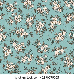 Vintage seamless floral pattern. Liberty style background of small white flowers. Small flowers scattered over a blue background. Stock vector for printing on surfaces. Abstract flowers.