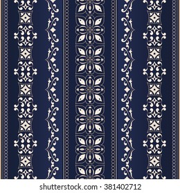 Vintage seamless golden border on dark blue background. Ornate element for design. Ornamental lace pattern for wedding invitations and greeting cards. Traditional floral decor.