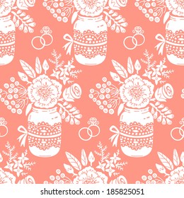 Vintage seamless pattern with a bouquet of flowers and wedding rings. Vector pattern.