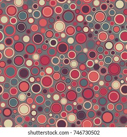Vintage seamless pattern. Consists of geometric elements arranged on a gray background. The elements have round shape, different color and size.