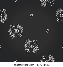 Vintage seamless pattern with couple of rings and heart. Background for eco forest wedding or autumn celebrations. Floral rustic symbols and elements in chalkboard hand drawing style.