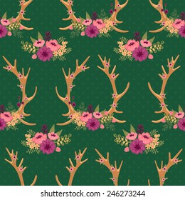 Vintage seamless pattern with deer antlers and flowers. Vector illustration.